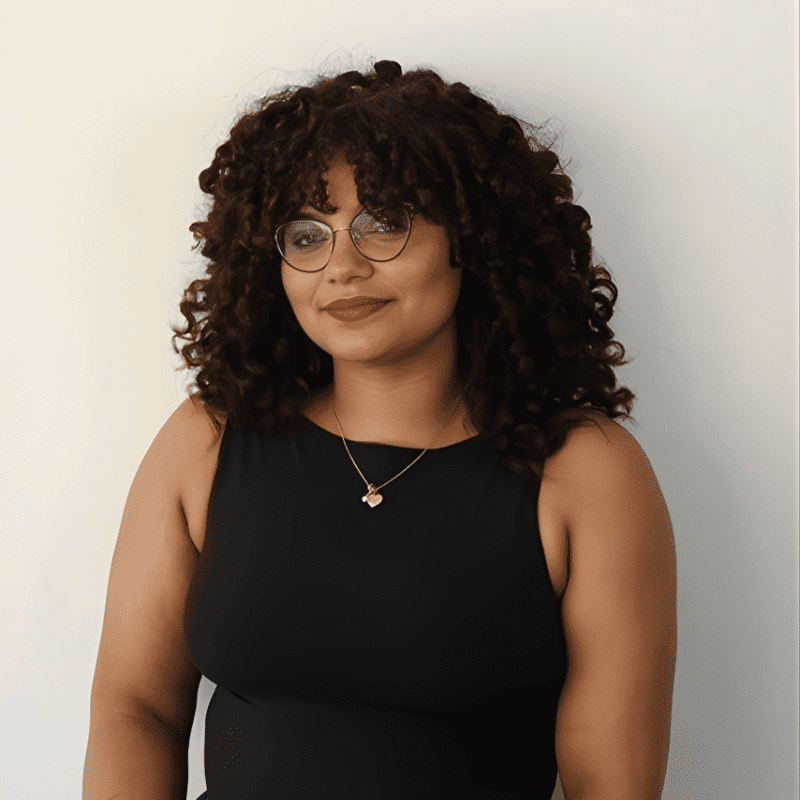 Portrait of Heaven, a professional stylist at DBK Hair Studio, showcasing their expertise and style.