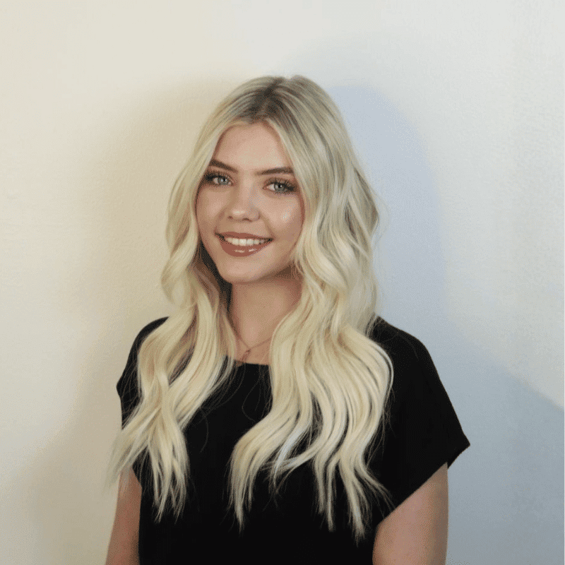 Portrait of Lauren, a professional stylist at DBK Hair Studio, showcasing their expertise and style.