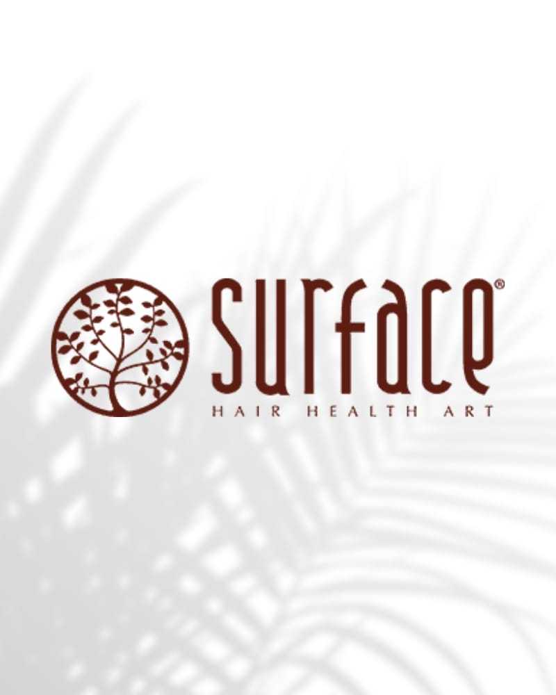 Surface logo with "Hair Health Art" text against a white background with leaf shadows.