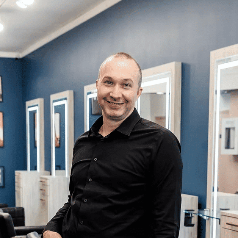 Portrait of Doug, a professional stylist at DBK Hair Studio, showcasing their expertise and style.