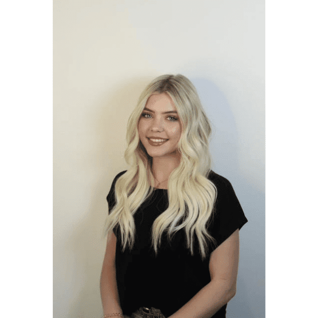 Portrait of Lauren, a professional stylist at DBK Hair Studio, showcasing their expertise and style.
