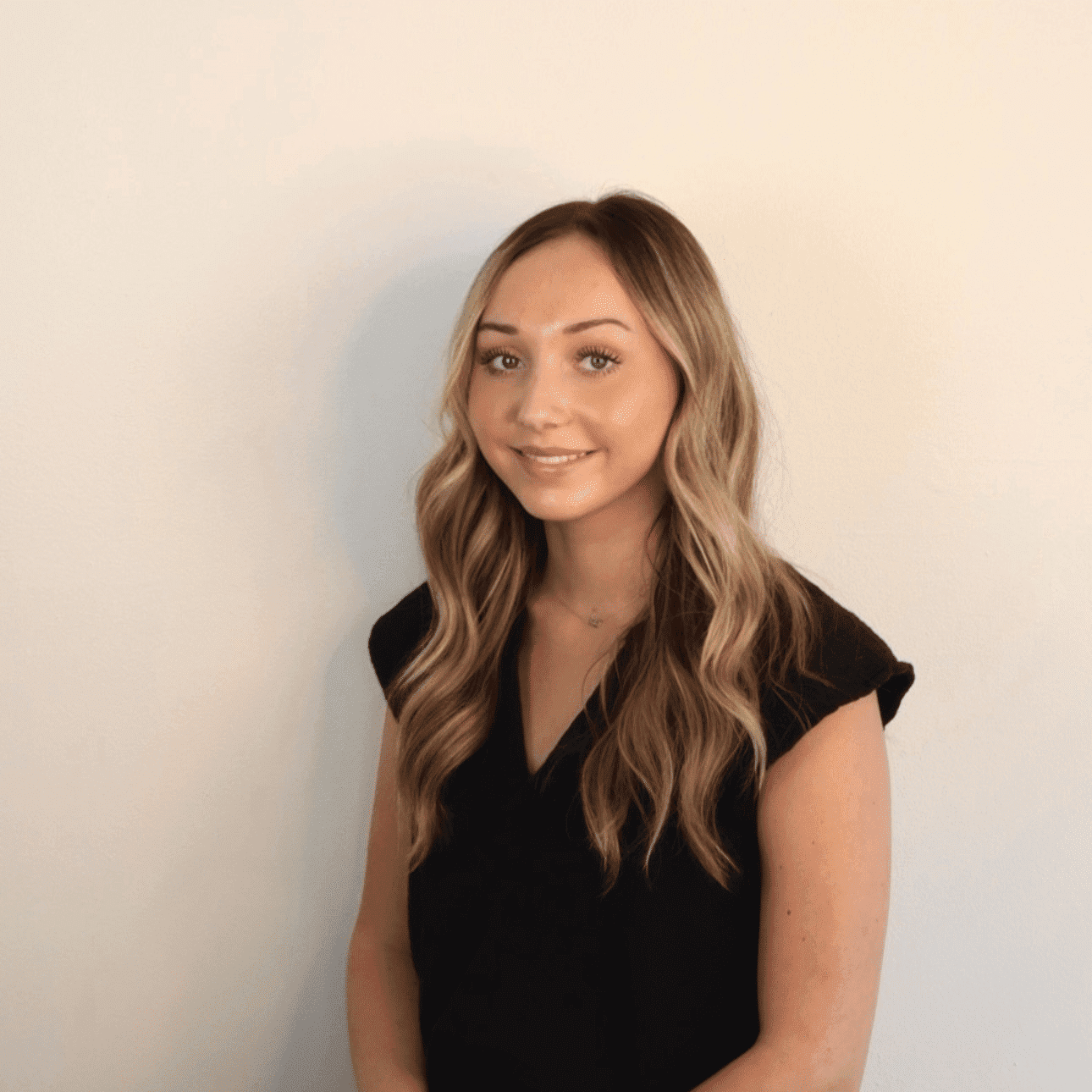 Portrait of Emma, a professional stylist at DBK Hair Studio, showcasing their expertise and style.
