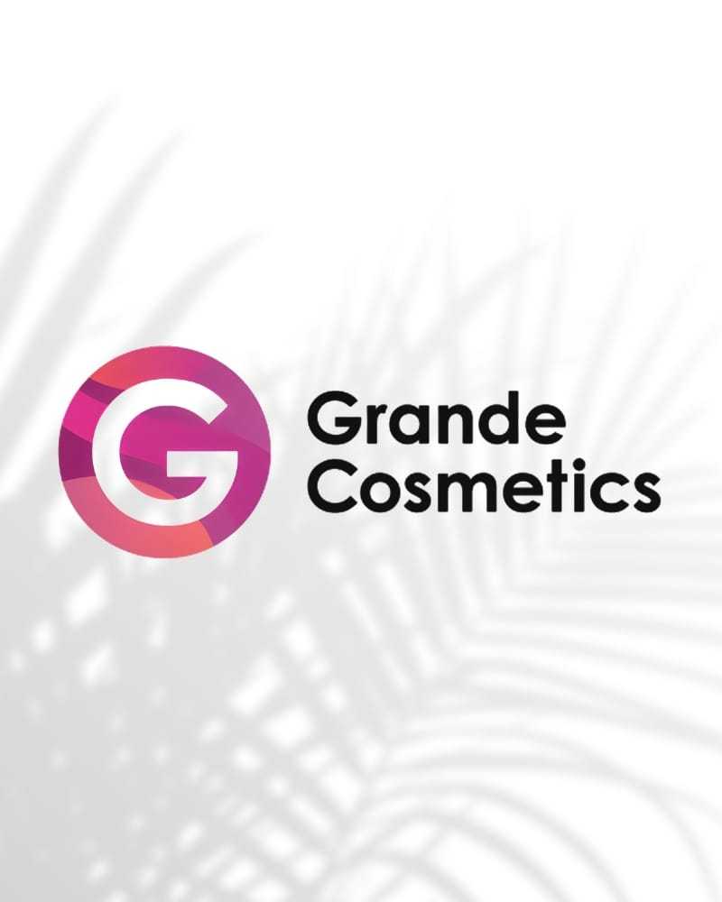 Logo of Grande Cosmetics with a pink 'G' and palm leaf shadow in the background.