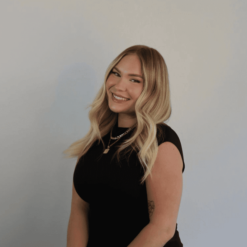 Portrait of Kelsey, a professional stylist at DBK Hair Studio, showcasing their expertise and style.
