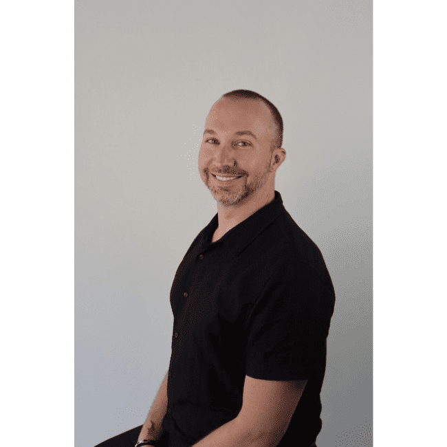 Portrait of Doug, a professional stylist at DBK Hair Studio, showcasing their expertise and style.