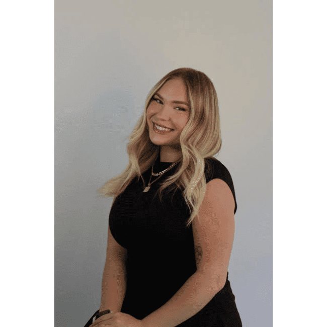 Portrait of Kelsey, a professional stylist at DBK Hair Studio, showcasing their expertise and style.