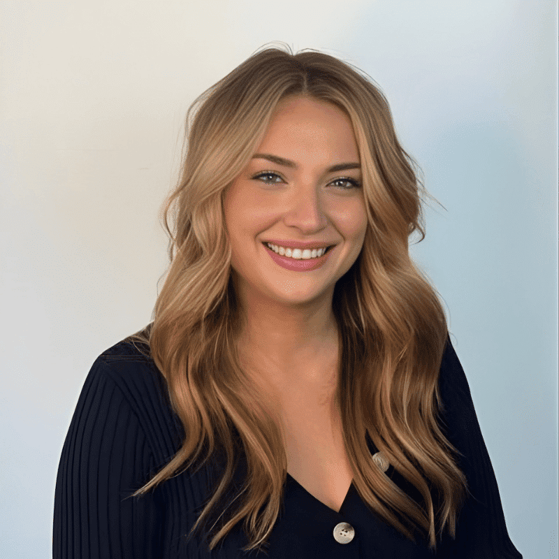 Portrait of Leslie, a professional stylist at DBK Hair Studio, showcasing their expertise and style.